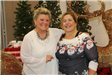 Two Women Take a Picture at the Christmas Celebration
