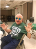 Elderly Man Wearing Party Glasses Strikes a Pose