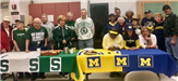 Eastern Michigan and Michigan State Fans Beside Each Others Tables