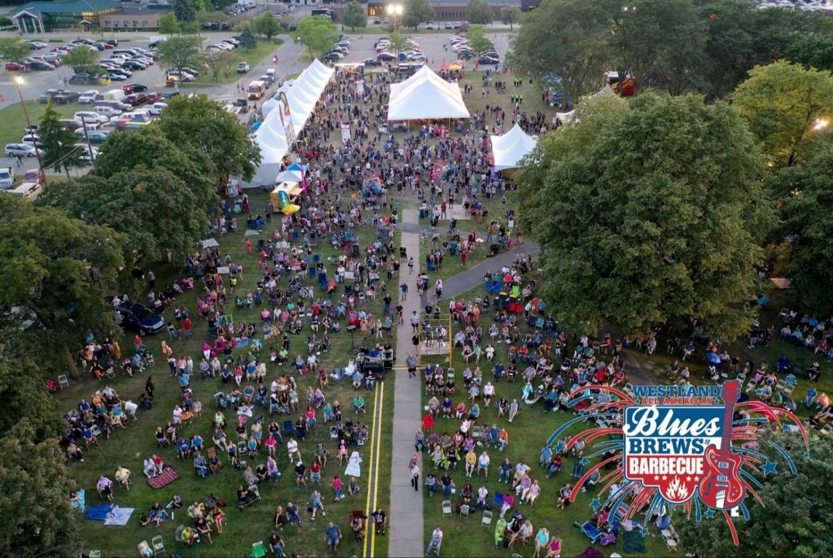 Blues Brews and BBQ crowd with logo