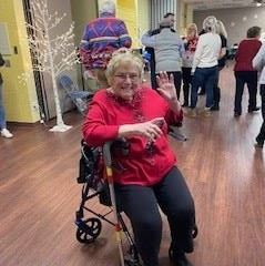 Christmas Party 2023 Woman waving