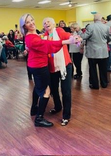 Christmas Party 2023 Two women dancing