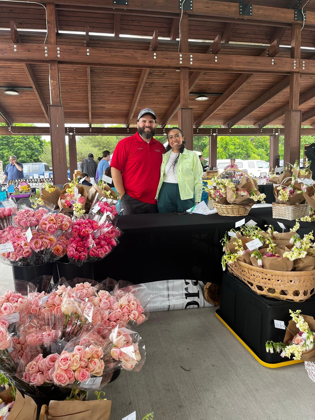 Man and woman selling flowers