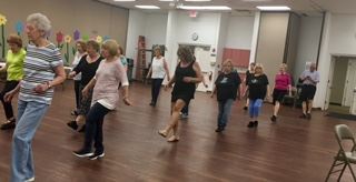 Seniors Walking in a line in an Open Room